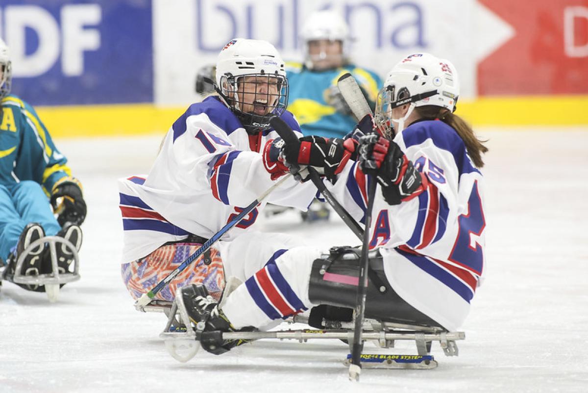Monica Quimby of the United States celebrates with her teammate in Para ice hockey at a women's tournament