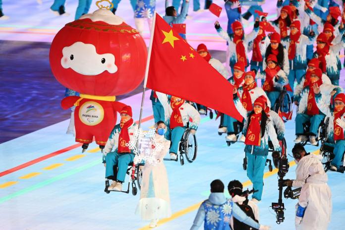 The red mascot of the Beijing 2022 Paralympics join Chinese athletes during the Parade of Nations