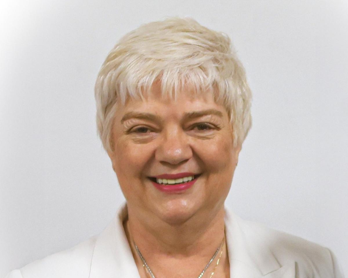 Charmaine Hooper is smiling at the camera