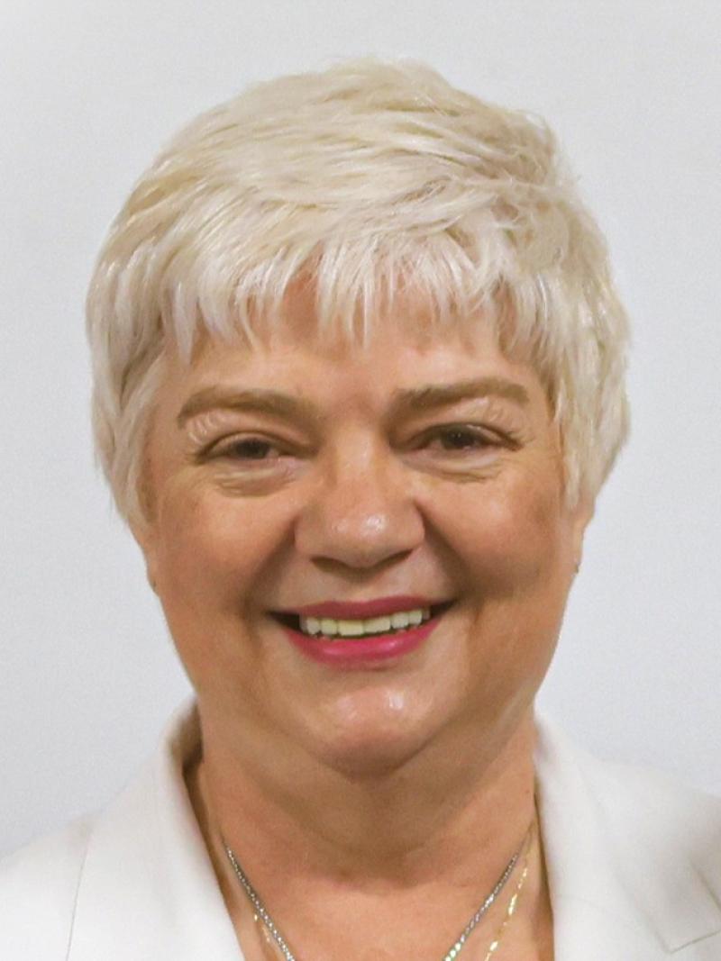 Charmaine Hooper is smiling at the camera