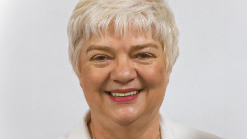 Charmaine Hooper is smiling at the camera