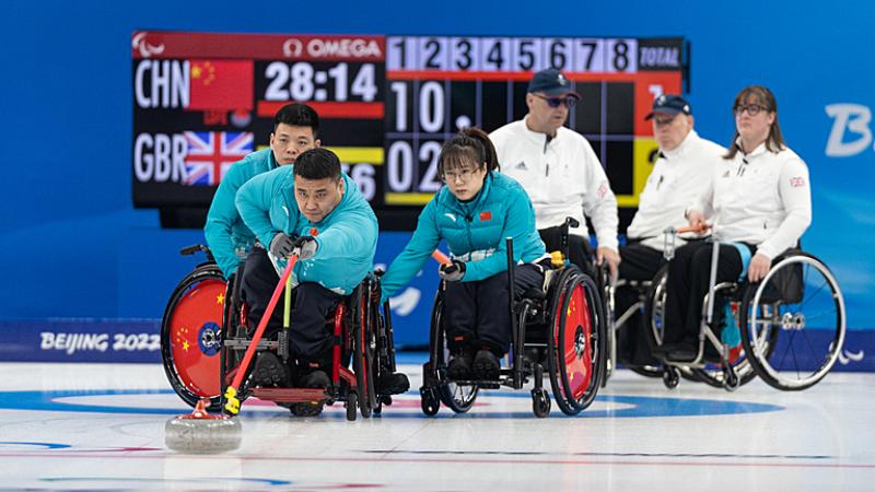 A Chinese wheelchair curler releases the stone