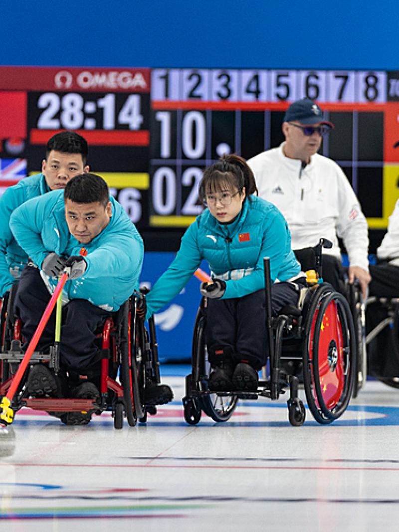 A Chinese wheelchair curler releases the stone