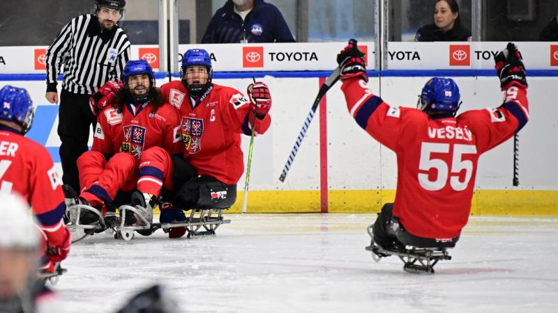Four Czech Para ice hockey players celebrating on ice