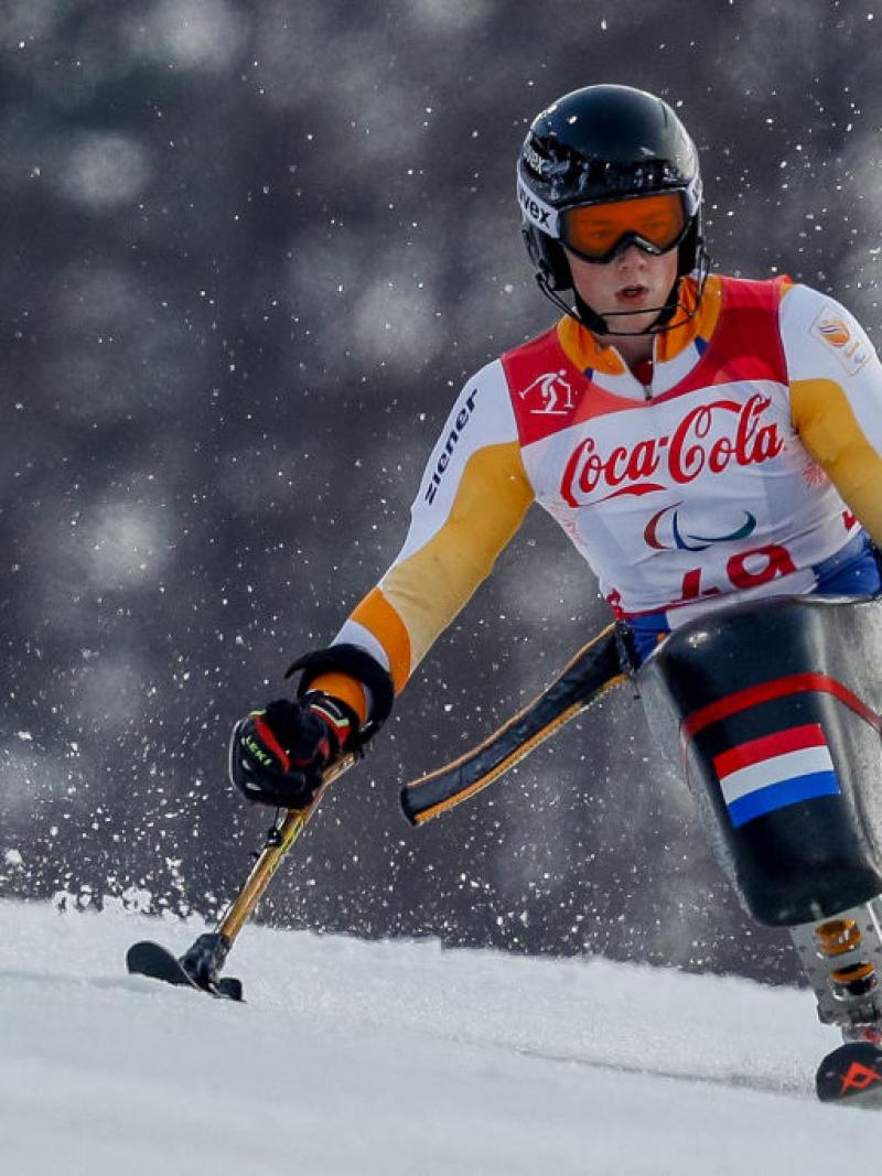 A male Para alpine sit-skier in competition.
