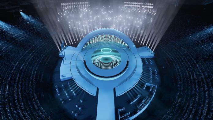 A mockup of the venue of the Paralympic Opening Ceremony with a blue stage in an outdoor venue