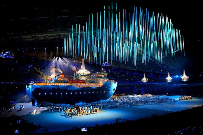 A huge ship on a stage during the Opening Ceremony of Sochi 2014 and there are blue lights projected from above