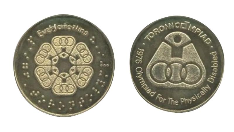 The front and back sides of the medal for the Toronto1976 Paralympic games.