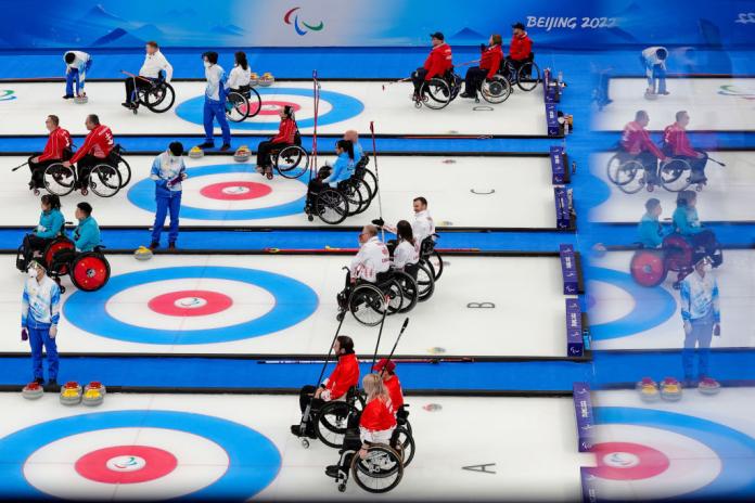A wide image of the wheelchair curling rink, there are four lanes